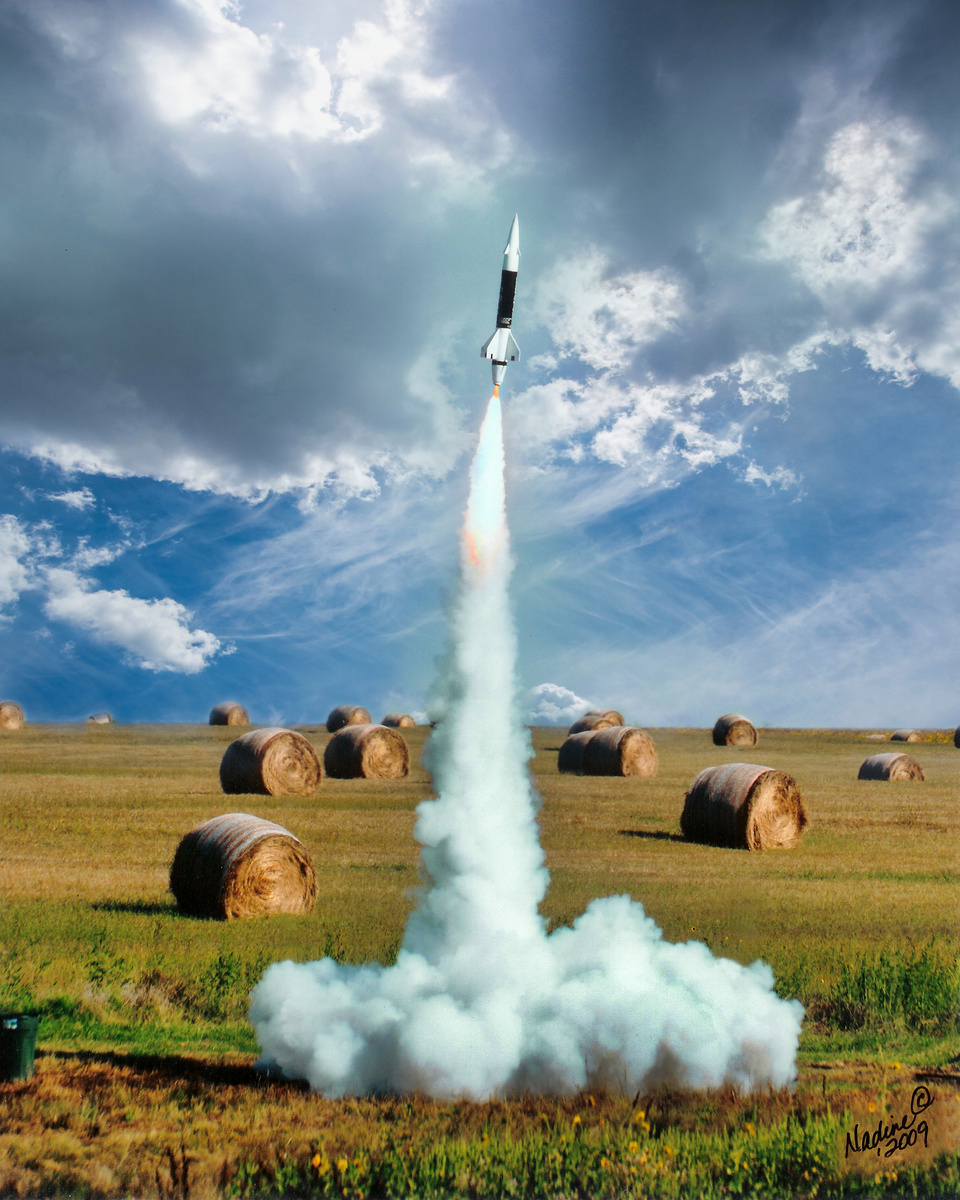 Launched model rocket in rural field